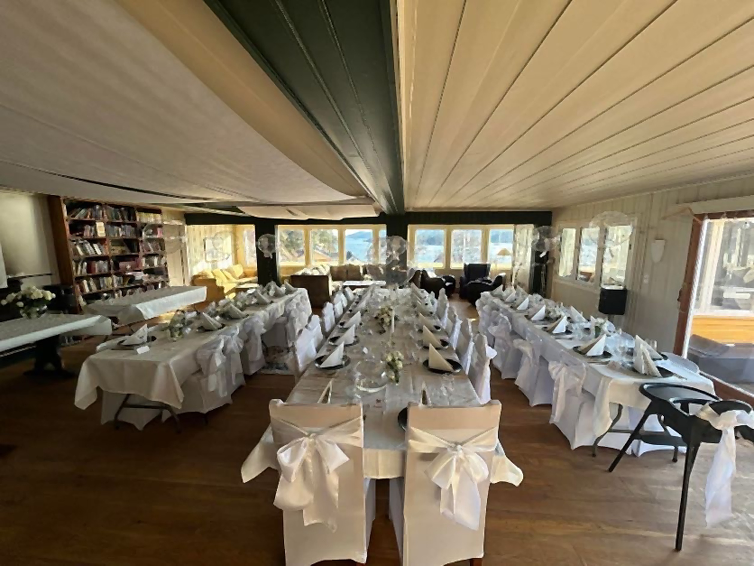 Wedding tables set in the dining hall at The Longhouse